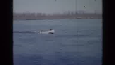 Minnesota USA (1958): Fishing Boat Moving Through The Lake With Two People