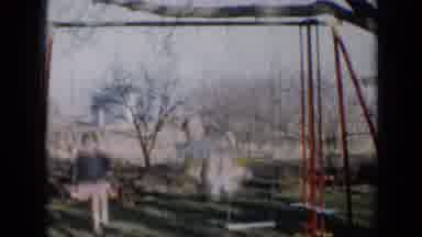 Minnesota USA (1958): Two Little Children Playing With On The Swing At The
