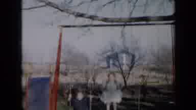 Minnesota USA (1958): Kids Playing On The Swings In The Park Having Fun