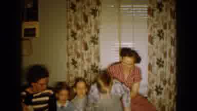 Minnesota USA (1958): Two Women With Their Small Children Seating In A Living Room