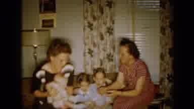 Minnesota USA (1958): Lady Passing The Baby To The Mother And Little Boy Walking