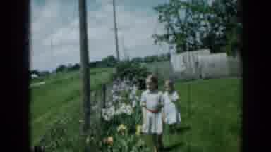 Minnesota USA (1958): Kids Walking Towards Camera Next To The Garden Of Roses