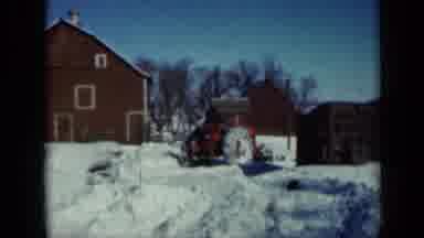 Minnesota USA (1958): Man Removing Excess Snow From His Property Accompanied By