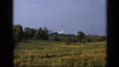Aledo Texas (1959): A Quiet Suburban Area With A Row Of Houses And Cars Parked
