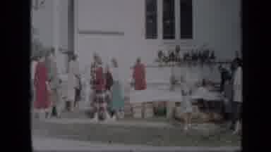 Aledo Texas (1959): Camera Following Two Women Walking Past A Table In Front Of A