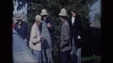 Aledo Texas (1959): Food Displayed On White Table And People Standing Next To Blue