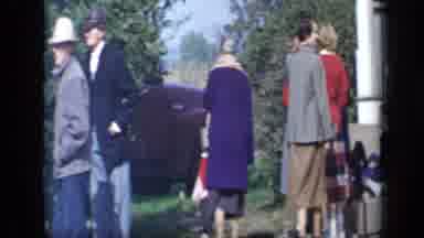 Aledo Texas (1959): A Group Of People Walk Around A Yard Viewing The Nearby Area