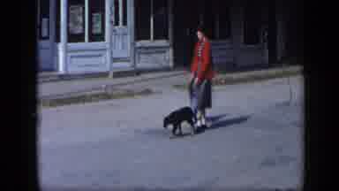 Aledo Texas (1959): A Lady Walking With Children Holding Puppies And A Man Sitting