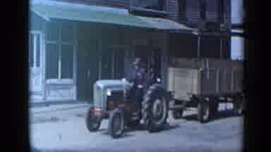 Aledo Texas (1959): 8n Ford Tractor Slowly Pulling A Wooden Wagon Down The Road