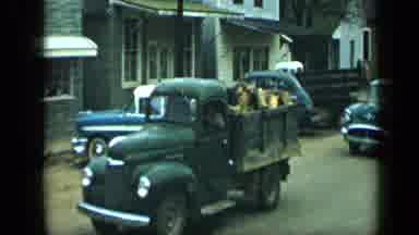 Aledo Texas (1959): Green Car Slowly Follows Green Truck On A Cloudy Day