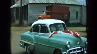 Aledo Texas (1959): A Compact Car With Streamers And A Goodwill Industries Truck