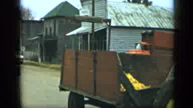 Aledo Texas (1959): People Riding Tractors With Wagons Behind Them