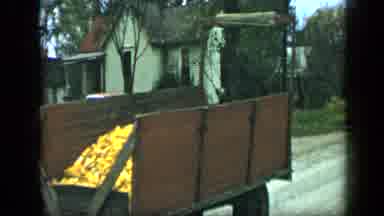 Aledo Texas (1959): A Tractor With A Carriage Full Of Yellow Vegetables On A Small