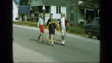 Aledo Texas (1959): Children Walking Down The Street With Hula Hoops And Riding