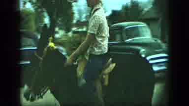 Aledo Texas (1959): A Man Walking Down The Street On Horseback Passing Children