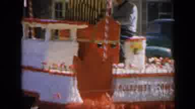 Iowa USA (1959): Person Playing Organ On A Float In A Parade