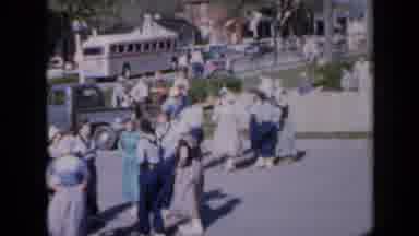 Iowa USA (1959): Costumed People Practicing Traditional Dance In A Parking Lot