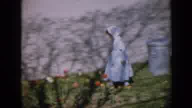 Iowa USA (1959): Footage Of A Little Girl Dressed In A Blue Dress And A Bonnet As