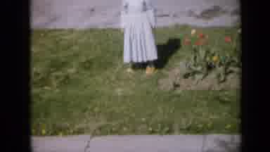Iowa USA (1959): Girl Standing Next To Flowers Waiting For The Picture To Be Taken