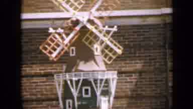 Iowa USA (1959): Windmill Is Rotating In Air And People Are Standing