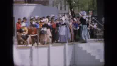 Iowa USA (1959): A Group Of Adults And Children Are Performing A Musical Act On