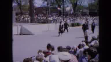 Iowa USA (1959): Four Old Men Walking In A Parade Like Manner Through Side Crowds