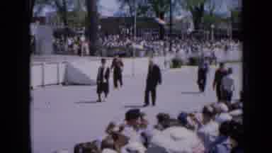 Iowa USA (1959): Officials Doing Rally And People Cheering Them With Flags In