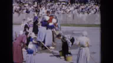 Iowa USA (1959): Ladies Dressed In Traditional Costume Washing The Paths While