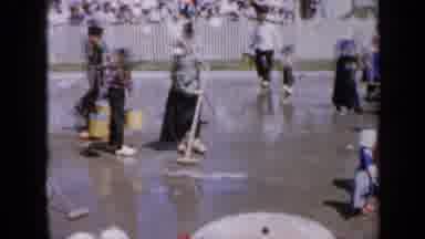 Iowa USA (1959): Groups Of People On The Street Mopping And Cleaning The Street