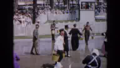 Iowa USA-1959: People In Period Costumes Carry Buckets And Poles At Community Event