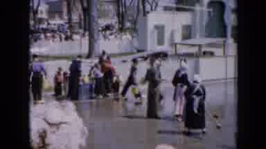 Iowa USA (1959): People Carry Buckets While Several Ladies Mop The Wet Street