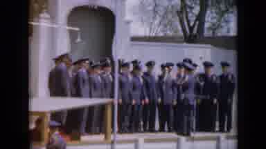 Iowa USA (1959): A Military Choir All Standing In Front Of A Monument Singing As