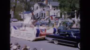 Iowa USA (1959): Black Classic Car Pulls Colourful Parade Float With Dazzling