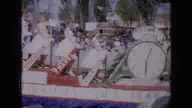 Iowa USA (1959): Women White Dresses Parade Float Men Walking Playing Instruments