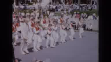 IOWA USA-1959: School Marching Band in White and Red Uniforms Leading Town Parade