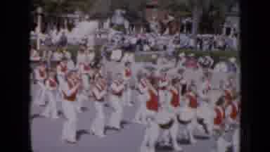 Iowa USA (1959): Marching Band In Festival Marching Down Road