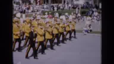 Iowa USA (1959): A Marching Band Marching Through The Street Playing Music