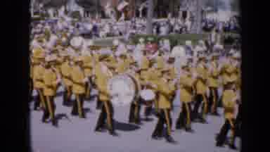 Iowa USA (1959): Marching Band In Festival Marching Down Road