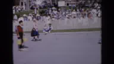Iowa USA (1959): People Wearing White Shoes Walking In Parade On A Sunny Day