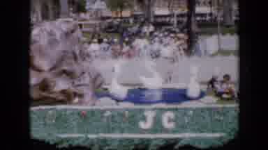 Iowa USA (1959): View Of Swan Parade Float With Red Marching Band On A Sunny Day