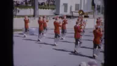 Iowa USA (1959): Marching Band Leads Colorful Float Down The Street In Parade