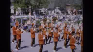 Iowa USA (1959): Three Bands Marching In A Parade During The Day With A Very