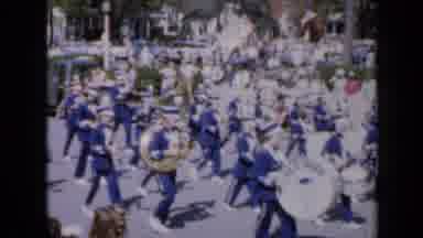 Iowa USA (1959): A Parade With A Car Passing In Front And Behind A Group Of People