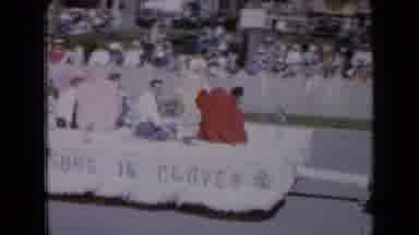 Iowa USA (1959): People Sitting In A Float Driving Down The Road