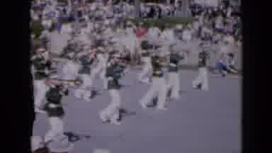 Iowa USA (1959): Marching Band In Festival Marching Down Road