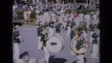 Iowa USA (1959): Band Wearing Blue And White Halts In Parade On A Sunny Day