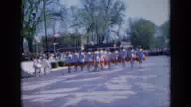 Iowa USA (1959): Tons Of People Dancing In Unison In A Parade As People Watch