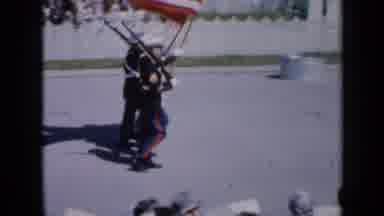 Iowa USA (1959): American Navy Marching Down With Guns Drawn Waving Flags
