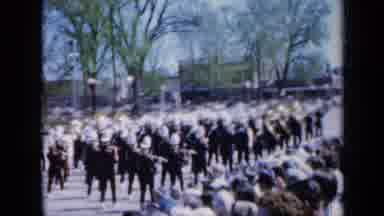 Iowa USA (1959): People Marching Down The Road With Swords Drawn On Their