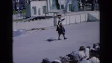 Iowa USA (1959): Shakespeare Actor Points Ahead As Beauty In Car Waves To Crowd